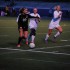 Kristen Janicki'15 attempts to steal the ball from a York player, while Izy Scott stands around and does nothing