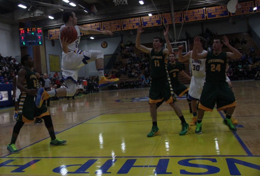 Harrison Niego 15 saves the ball from going out of bounds versus Stevenson on Nov.25.