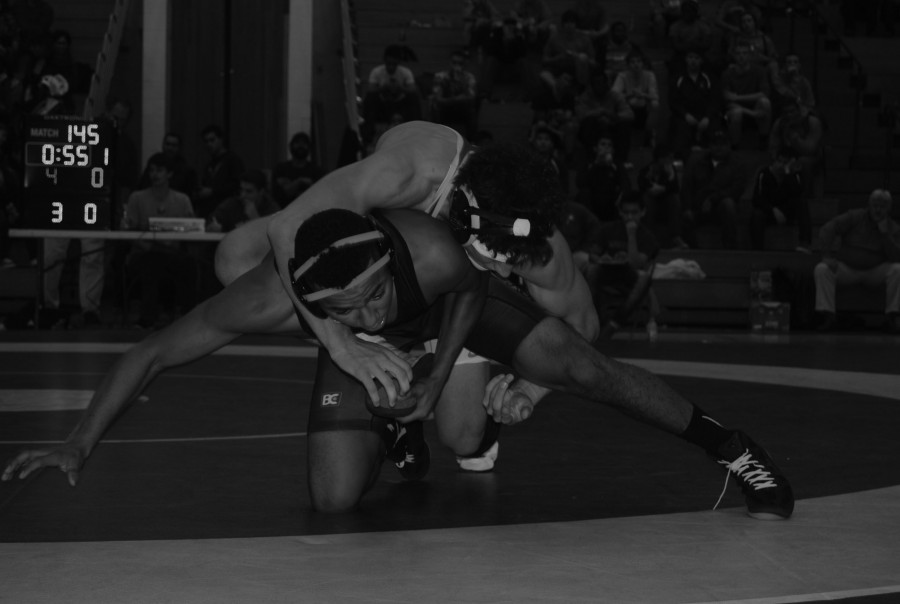 Johnny Mologousis '17 rides his Plainfield East opponent on Nov. 26. 
