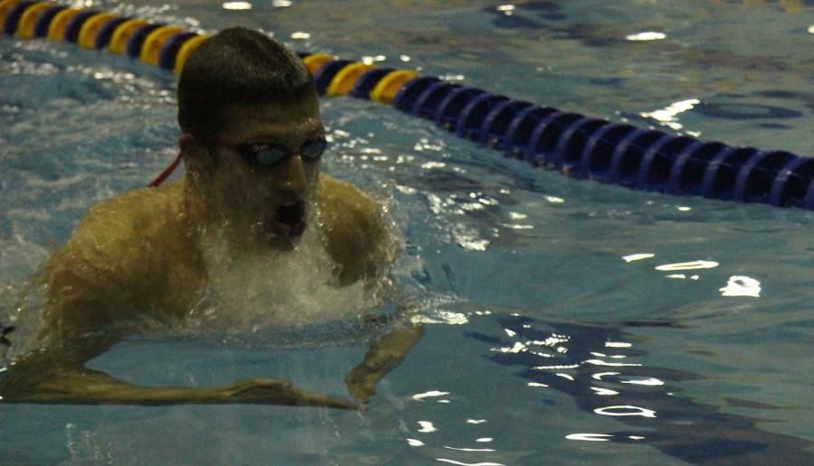 Lucas O'Brien'15 swims breaststroke at a Lyons Township meet in January. 