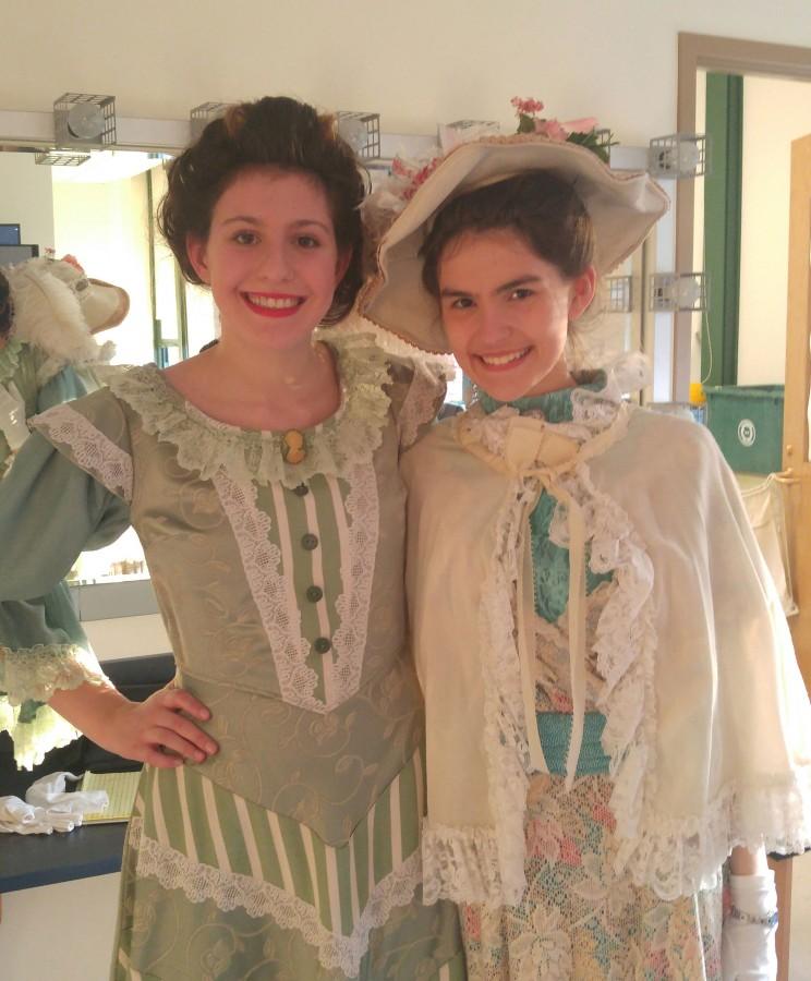 Alexandra Kales 18 (left) and Sarah Valeika 18 (right) pose in their costumes before rehearsal (Charlie Stelnicki).