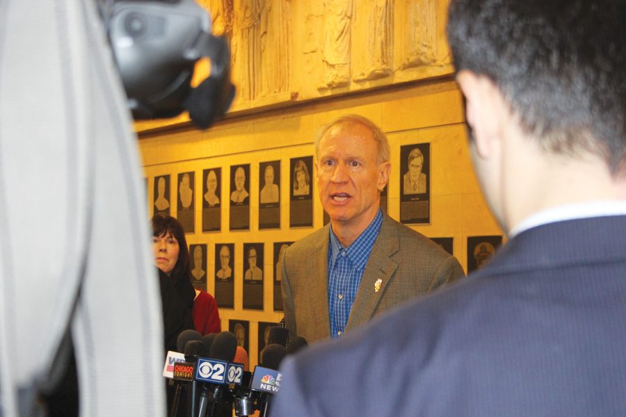 Bruce+Rauner+answers+questions+from+media+outside+Reber+Center+%28Melrose+Buckler%29.