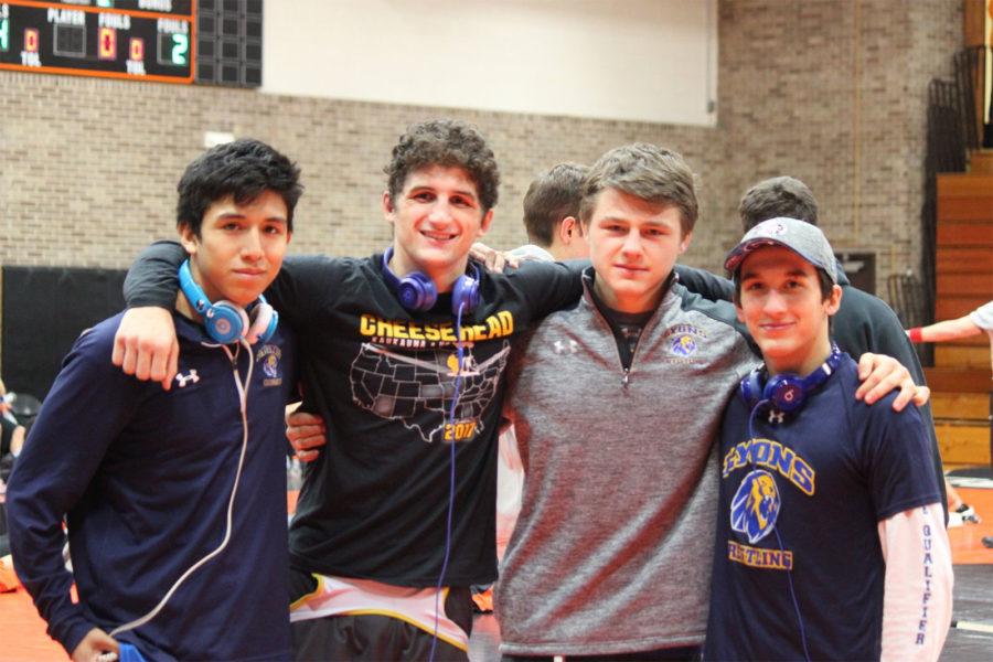 Four keen varsity wrestlers to graduate