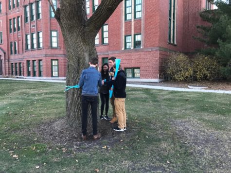 LT students tie ribbons, commemorating child’s battle with cancer