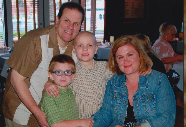 Dominic Cairo, center, died of cancer in 2011 when he was 8 years old.