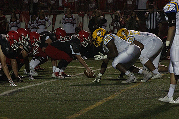 Andrew Ezell 18 lines up for the snap against Hinsdale Central. Ezell will attend Highland Community College.