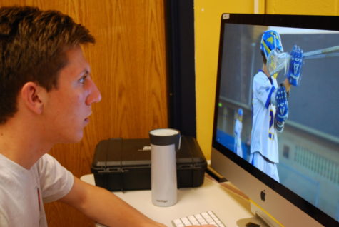 Max  Abrahamson looks over some of his work at the LTTV studios.