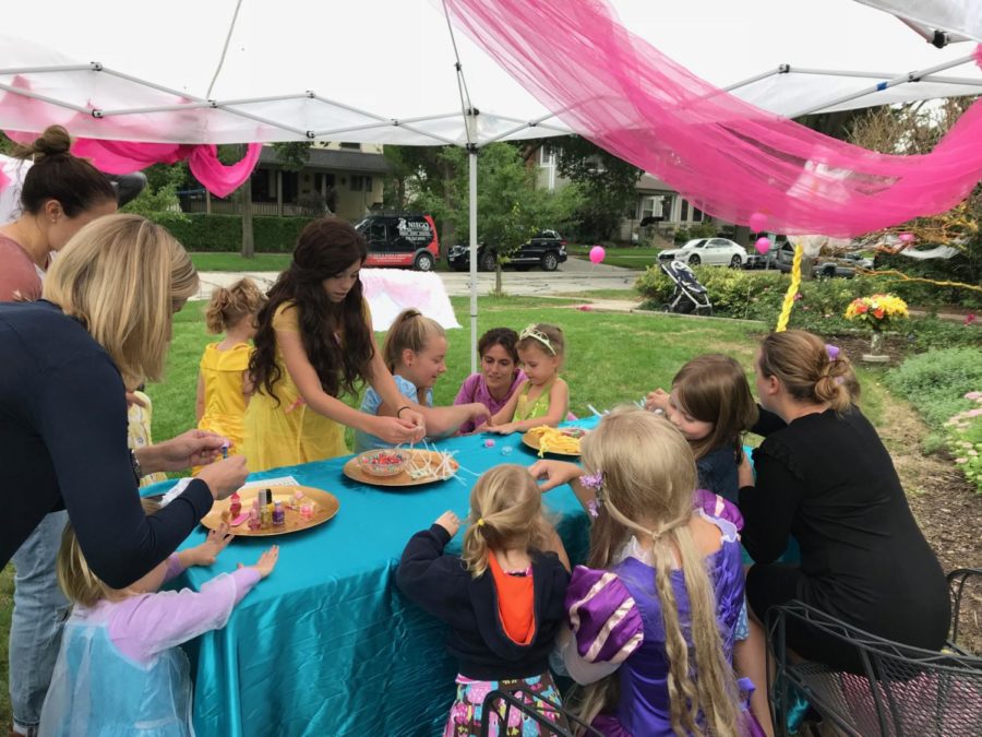 The princesses help children make crafts at the most recent party on Oct. 13 (Dougherty/LION).