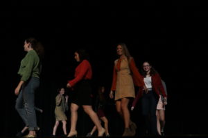 Models show off clothes in the Reber Center (Menna/TAB).