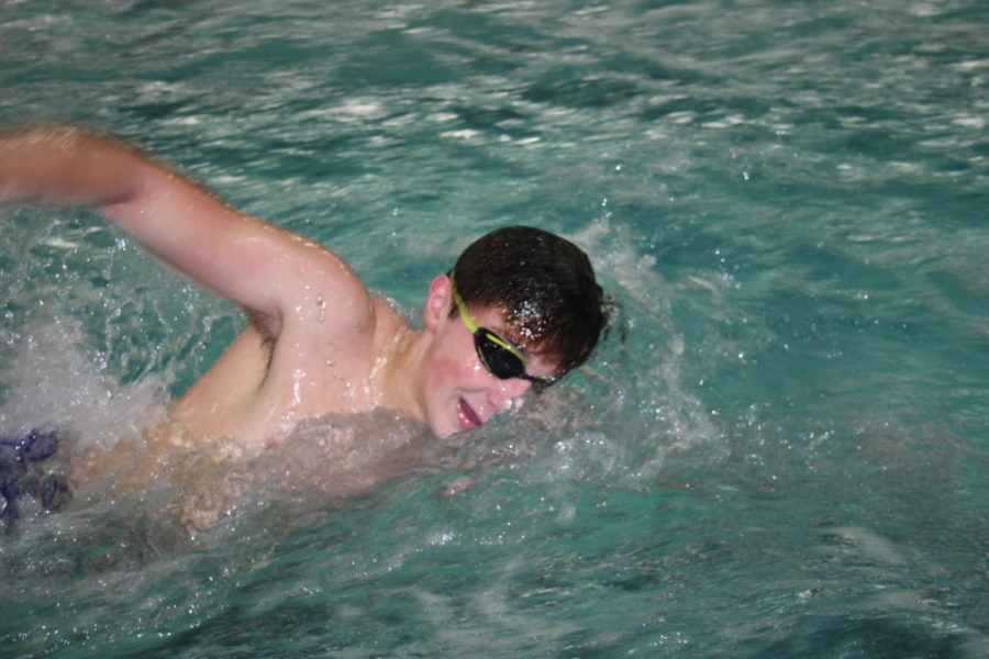 Paul Racanelli 21 swims freestyle during practice (Bonfiglio/LION).