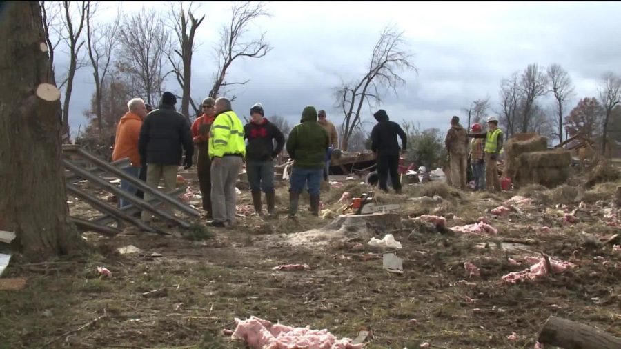 Residents survey the extensive damage done to homes in Taylorville (Tribune News Service).