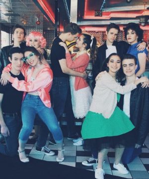 Grease cast pose at diner. (promotional photo)