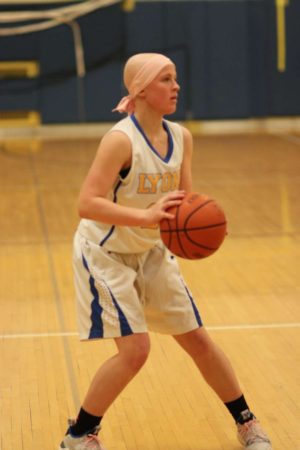 Despite being diagnosed with Hodgkins Lymphoma, Allie Kuhlman 22 continues to play basketball for LT.  (Photo provided by Megan Guzlas)