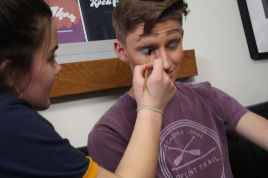 Desa Bolger works on Andy Danburys eyes in preparation for the Rock-a-thon drag race competition.  (Lonnroth/LION)