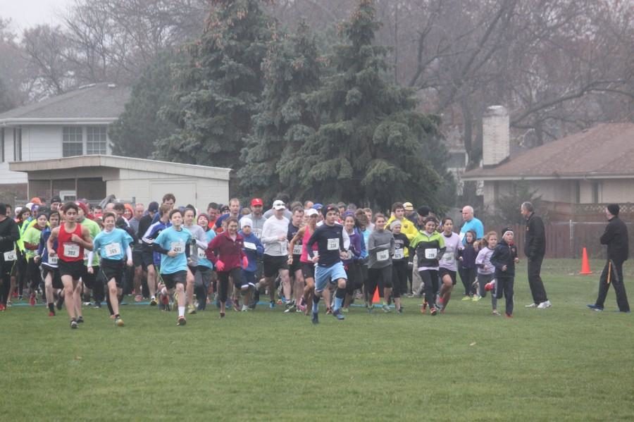 Runners bolt at a the Run for Kelli race. The run helps raise money for scholarship that are given in the memory of the Kelli Joy O’Laughlin. (Quinlan/LION)