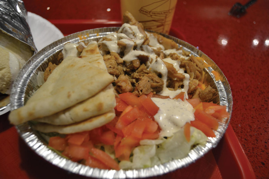 The chicken platter from “The Halal Guys’” that includes basmati rice, lettuce, tomato, hummus, and white sauce. (Bonfiglio/LION)