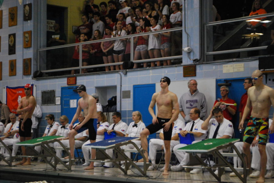 Walsh prepares for the 50-yard freestyle at the 2019 IHSA state swim meet at New Trier High School (Claesson/LION). 