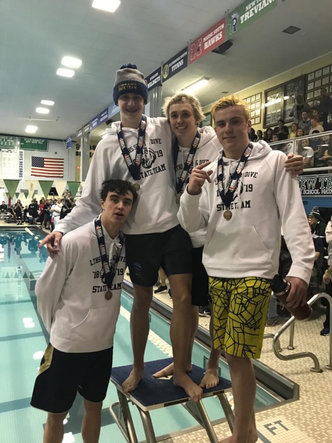 Medley relay team posing with their medals after winning the state title at New Trier on Feb. 23 (Donatelli).