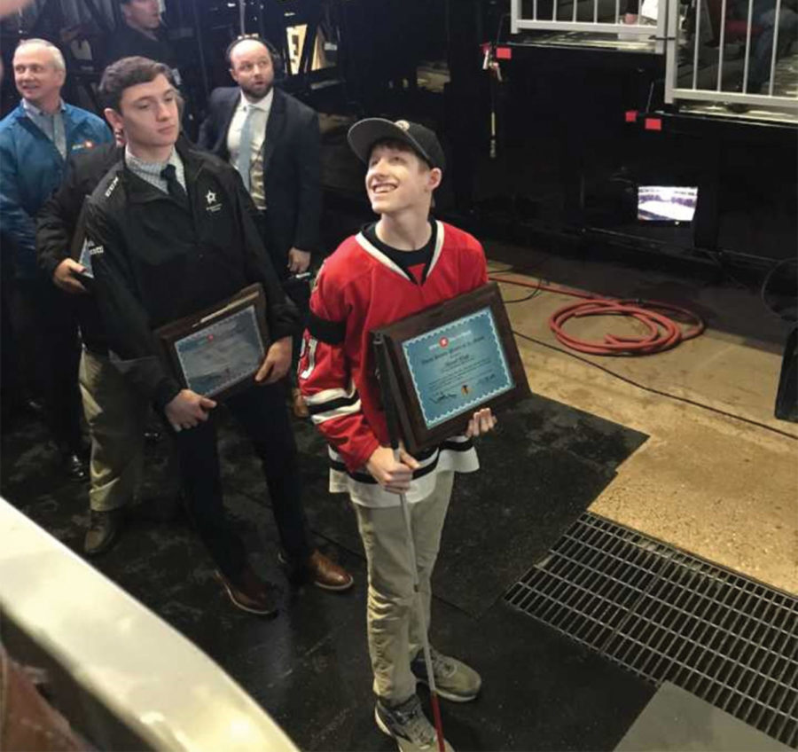 David Kopp 20 was awarded the Youth Player of the Month plaque by the Chicago Blackhawks on the Ice of the United Center Feb. 22. (Photos provided by Keeve) 