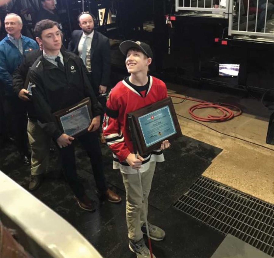 David Kopp '20 was awarded the Youth Player of the Month plaque by the Chicago Blackhawks on the Ice of the United Center Feb. 22. (Photos provided by Keeve) 