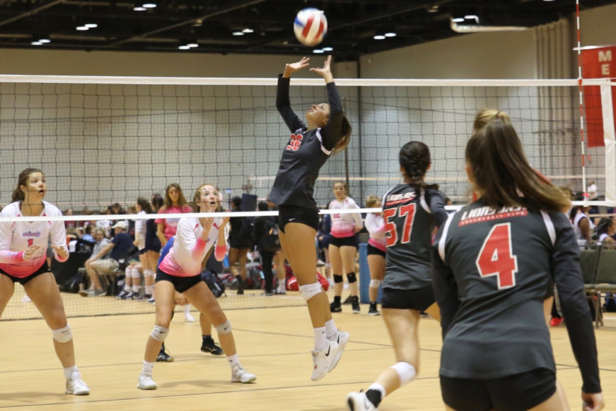 Lizzie Patel ‘21 sets up a hitter at a First Alliance volleyball tournament during her club season (photo courtesy of Patel).