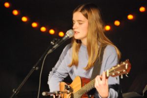 Allison Keeley ‘20 sings an original song  and plays guitar at Monster Bash (Janik/LION).