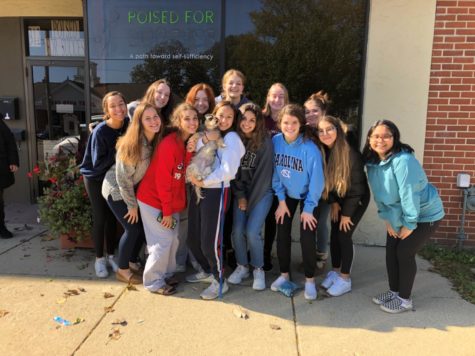 SAP poses for a photo after volunteering at