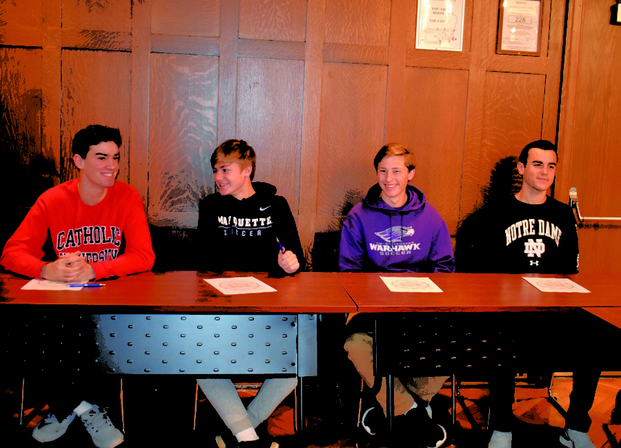 Luke Geraghty '20, Joey Fitzgerald'20, Zack Kristy '20 and Alex Salvino '20 chat and wait to sign (Riordan/LION). 