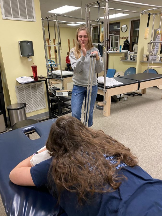 Tess Grzegorek helps a patient at the rehad facility in Countryside (photo courtesy of Grzegorek). 