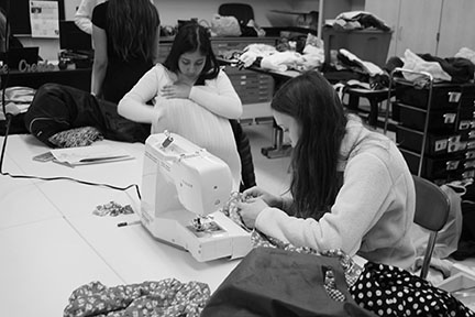 Club members sew articles for fashion show (Riordan/LION).