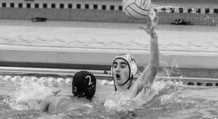 Bobby Bolan 20 catches the ball during game and prepares to pass the ball to his teammate (photo courtesy of Tom Musch).