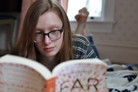 Sophia Schultz 21 reads one of the book in her social distancing book club.