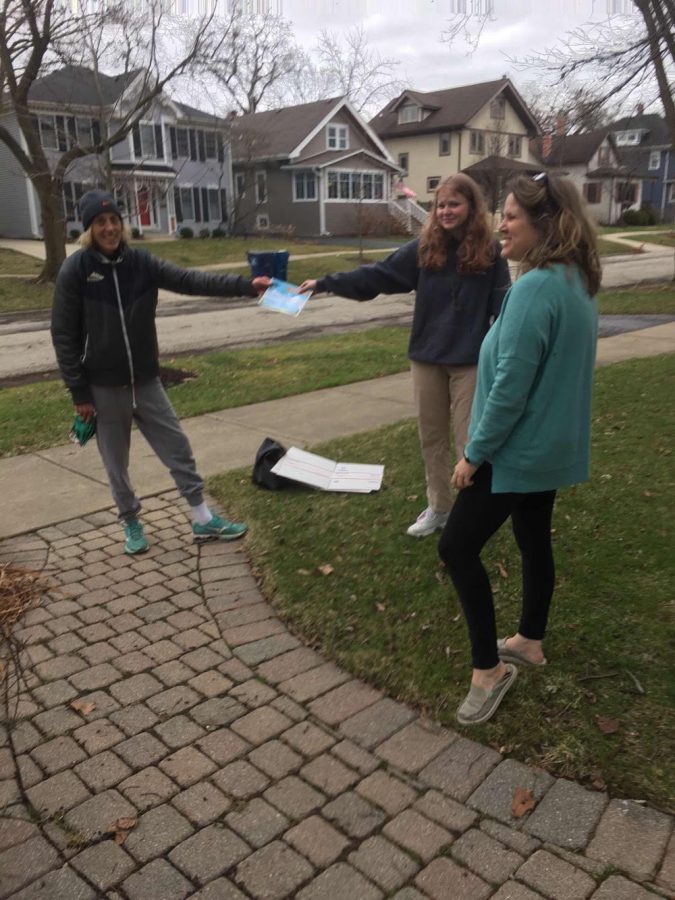 Livi and Darcy Kriha stand 6ft away from their neighbor as they help in whatever way they can (courtesy of Livi Kriha). 