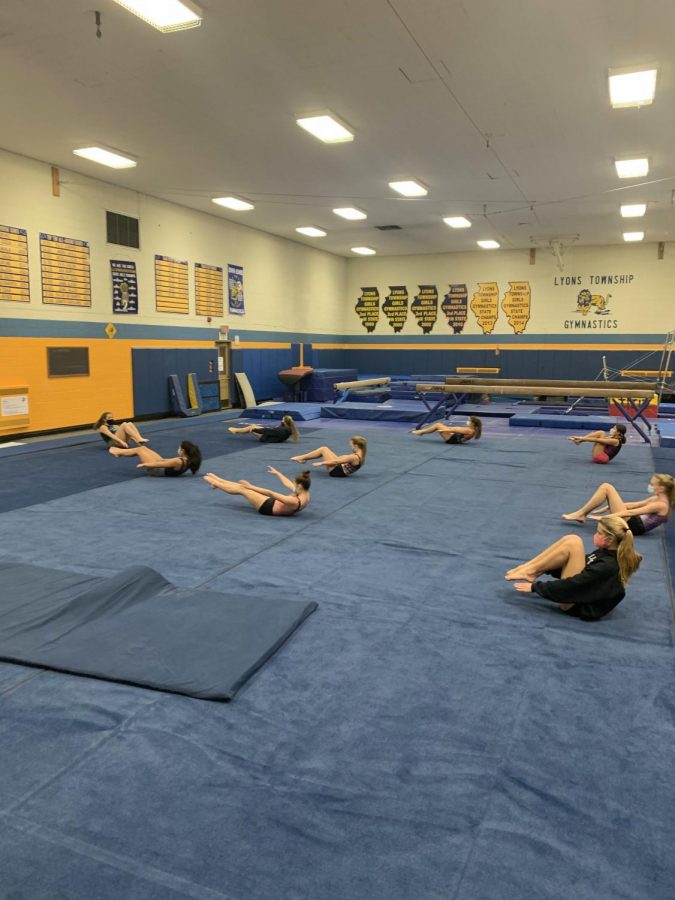 Girls+gymnastics+team+at+practice+before+the+pause+on+sports.+%28photo+by+Darragh+McDermott%29+