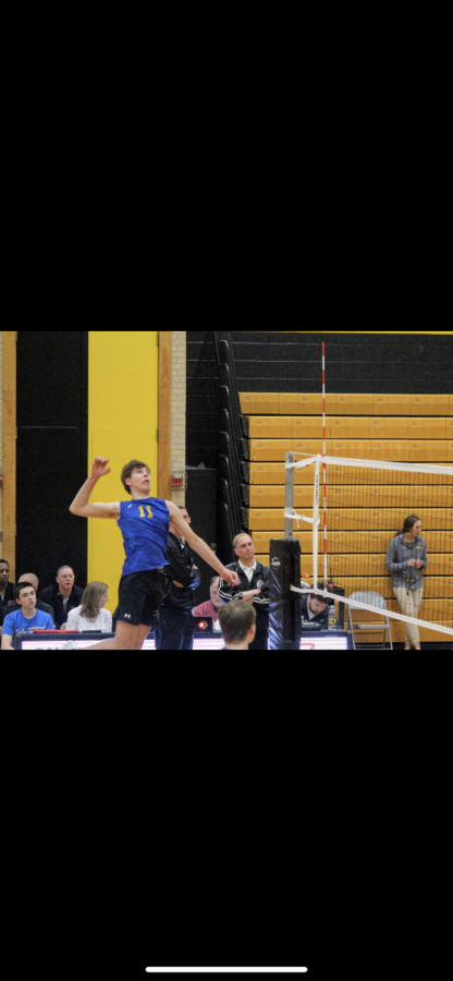 Markworth goes up for a spike at a LT volleyball game (photo by Jason Markworth)