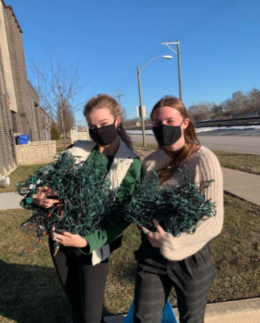 LT Recycling Club members Lindsey Moran ‘21 and Lauren Klusendorf ‘21 with collected lights at North Campus (Joan Machaj ‘21)