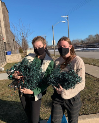 LT Recycling Club members Lindsey Moran ‘21 and Lauren Klusendorf ‘21 with collected lights at North Campus (Joan Machaj ‘21)
