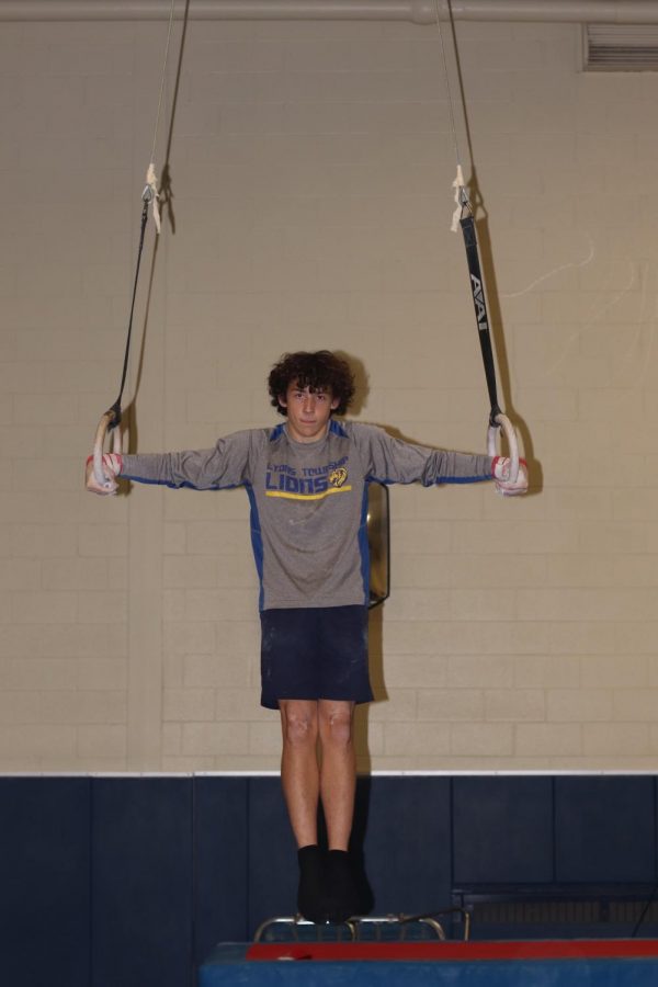 Ben Taylor 21 holds an iron cross during practice (photo courtesy of Cahill).