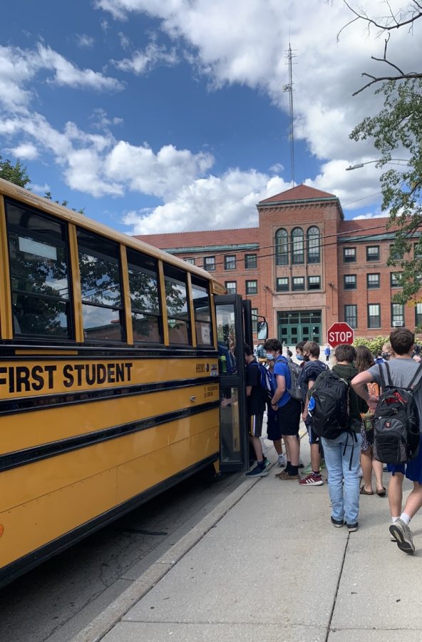 Students boarding the bus afterschool (Whelton/LION).