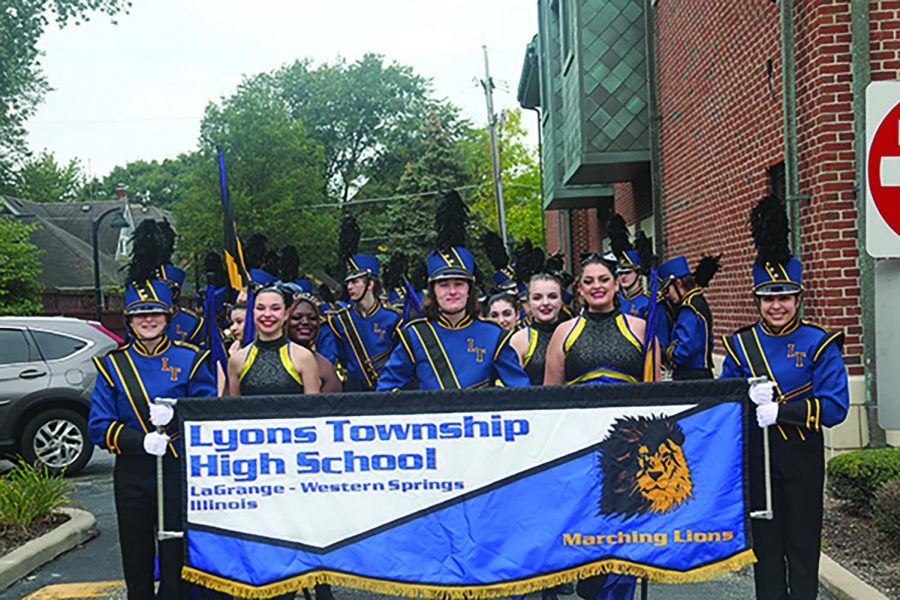 Band members pose before their march at La Grange Pet Parade (Mahaney/LION). 