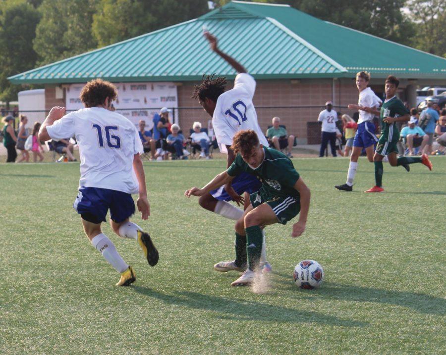 Fisher Daniels 22 and Dom Panopoulos 22 fight against Boylan Catholic High School during Sept. 12 game (Simek/LION).