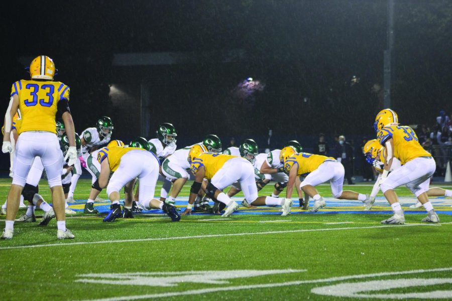 Lyons Township defense lines up against Glenbard West offense prior to the snap in game on Oct. 15 (Burke/LION).