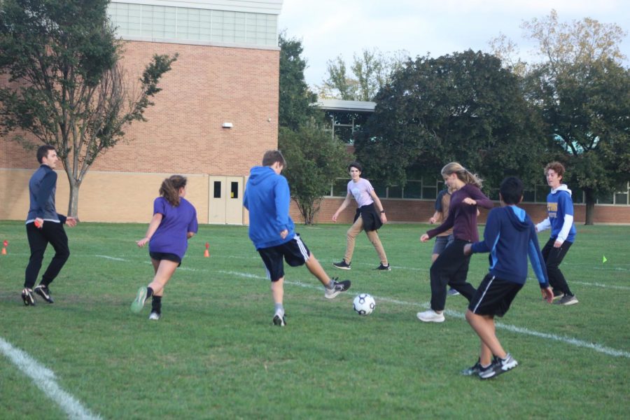 Students in Latin club compete against students in French club on Oct. 21 in the final soccer match on the fields behind SC (Wolf/LION).