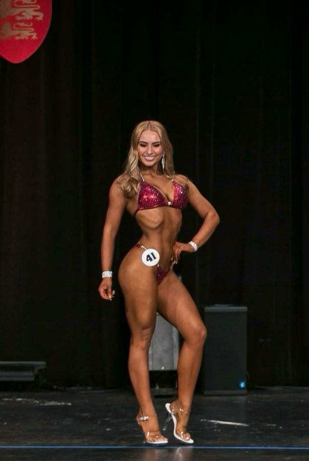 Isabel Blackstone '22 poses during a bodybuilding competition on Oct. 9 at Jefferson High School (photo courtesy of Blackstone).
