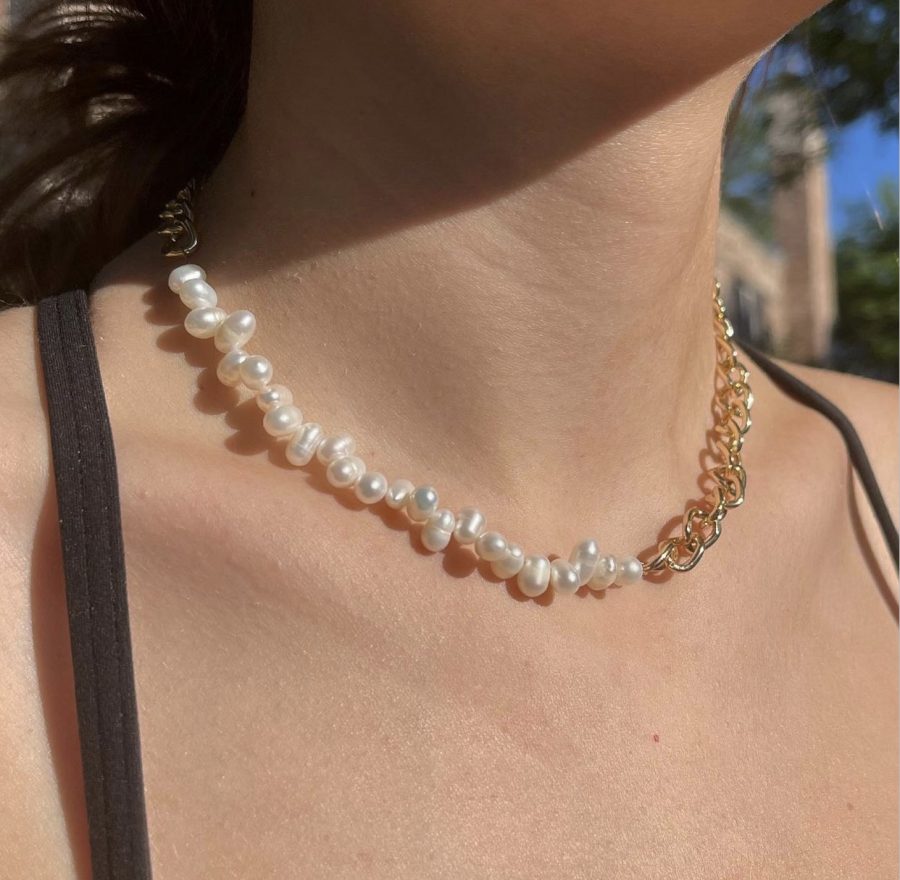 Emilija Risteska '22 models the June necklace, a design sold by Jaded Jewelry (photo courtesy of Malik). 