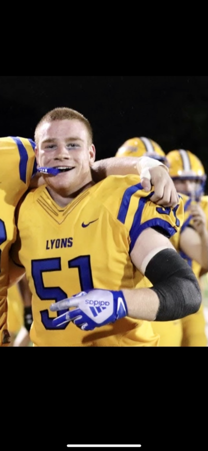 Cole Lagowski 22 poses with teammates after LT football win over Addison Trail on Sep. 3 (photo courtesy of Jackie Clifton).