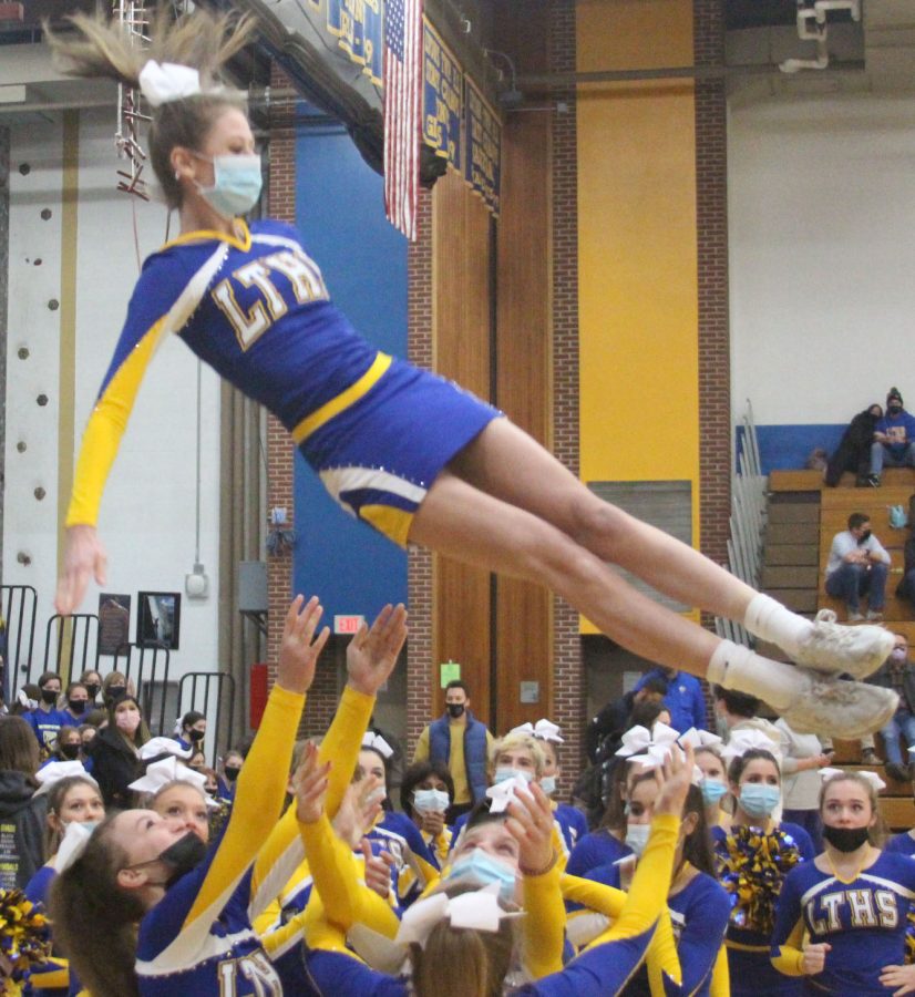 Elle 
ownby 23 performs stunt at home basketball game vs Oak Park River Forest on Jan. 7 (Wirtz/LION).