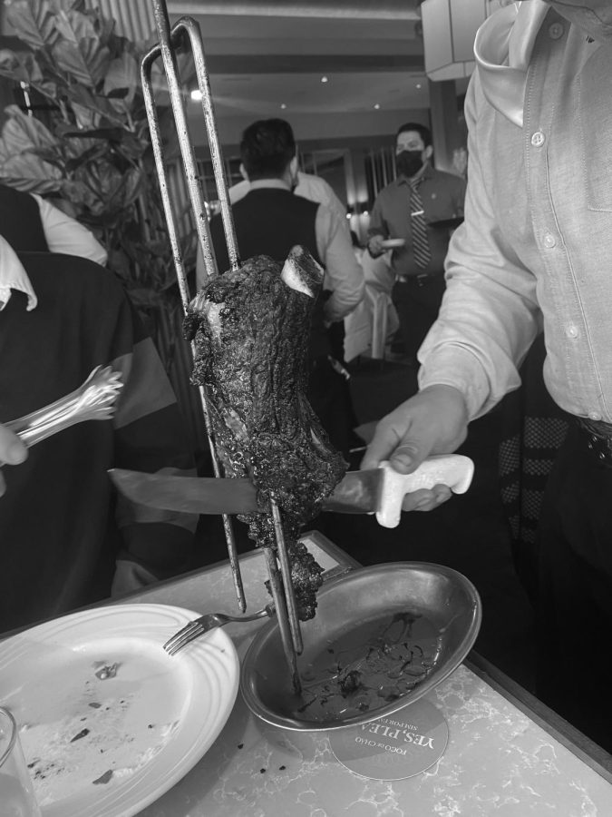Ribeye steak being served on a skewer at Fogo De Chão (Hepokoski/LION).