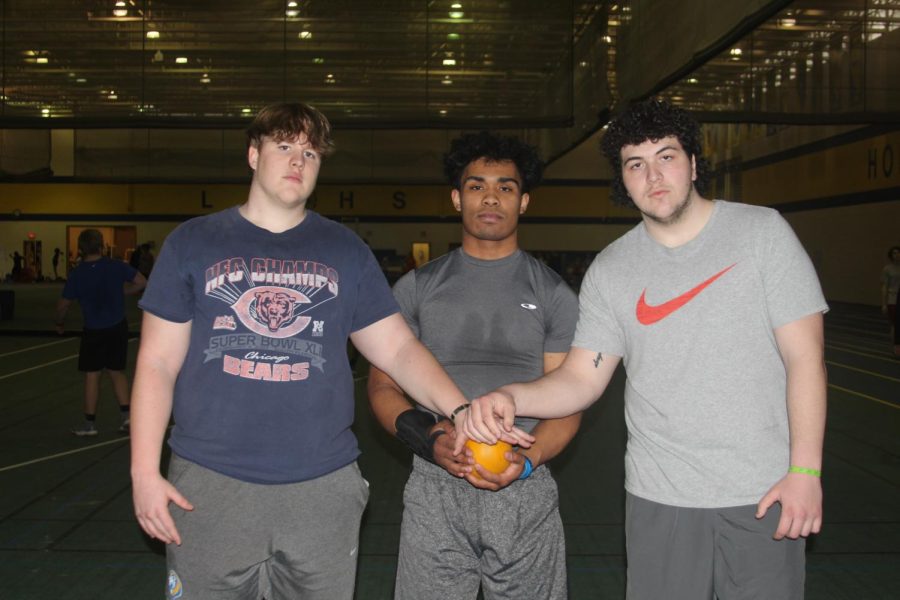 Liam cashin 22, Isaias Lopez 22, and Kyle Barron 22 hold a shot during practice on March 10 (Wirtz/LION).