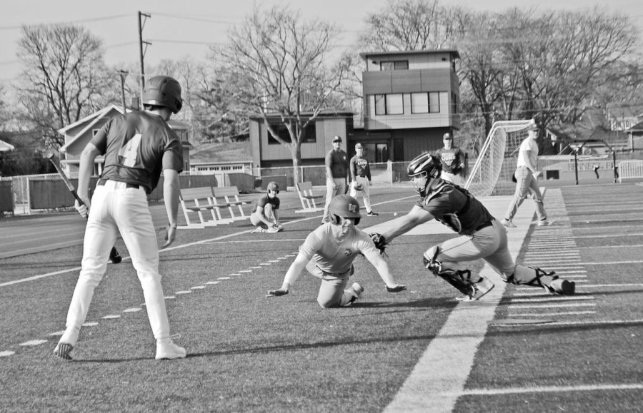 Troy Stukanberg 23 tries to avoid tag from Jack Legan 23 at a March 14 practice on Bennett Field (Barbera/LION).